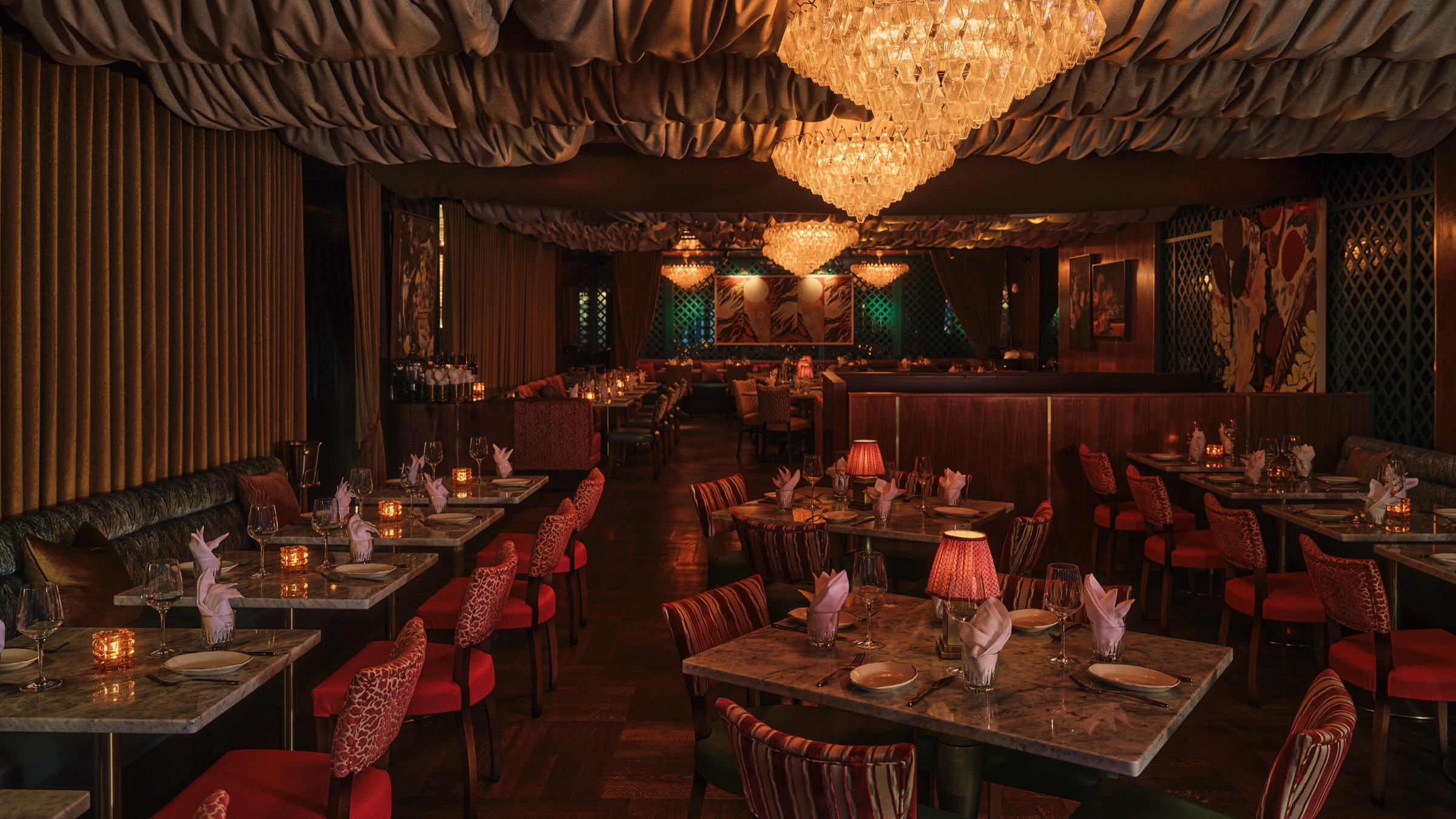 Candlelit dining room at Sirrah, a modern French steakhouse in the Meatpacking District